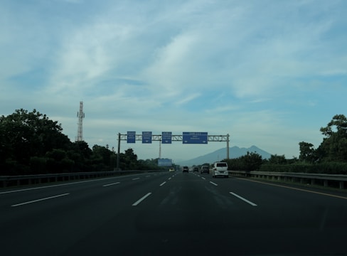Researchers installing sensors on a highway for data collection.