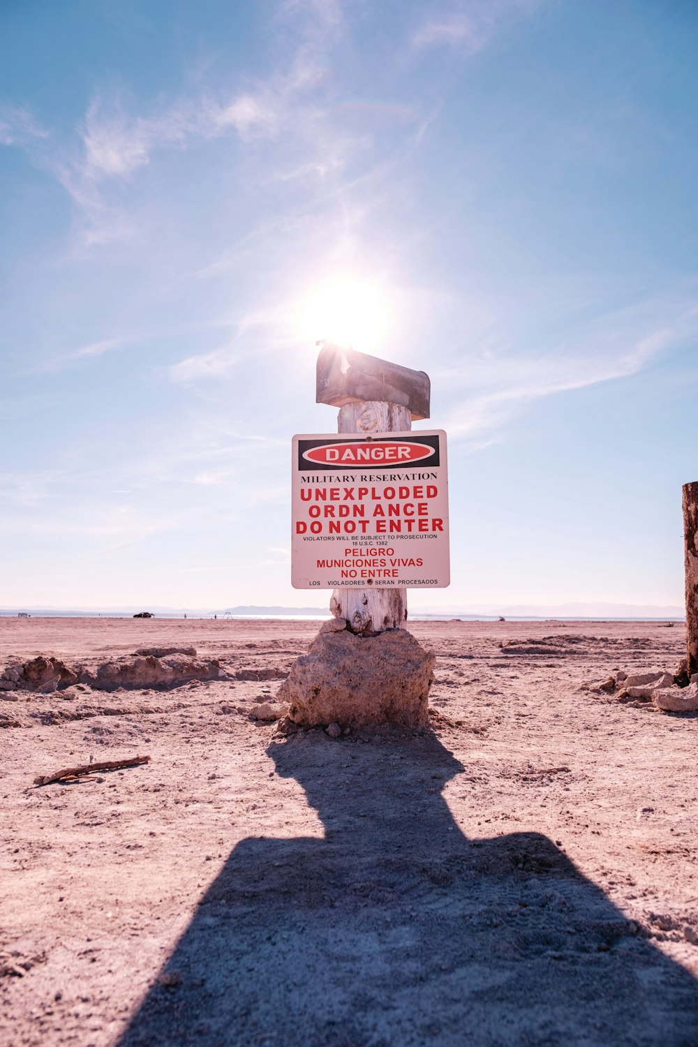 a sign that is sitting in the dirt