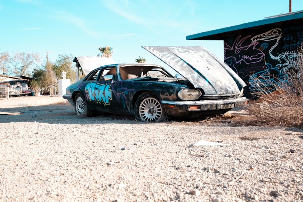 a car that is sitting in the dirt