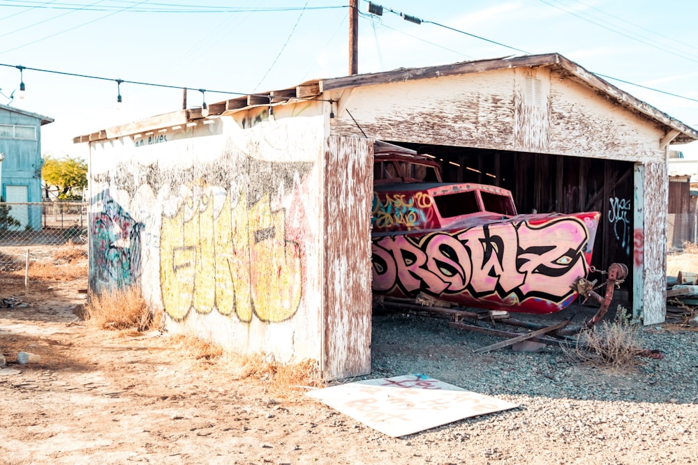 a run down building with graffiti on it