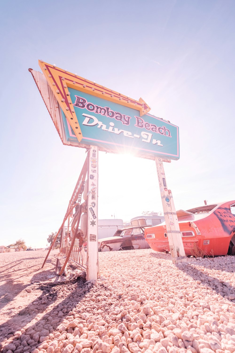 a sign that is sitting in the sand