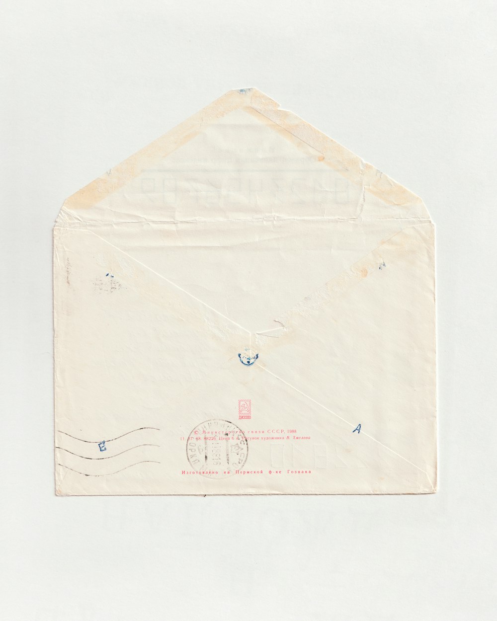a white envelope with a red stamp on it