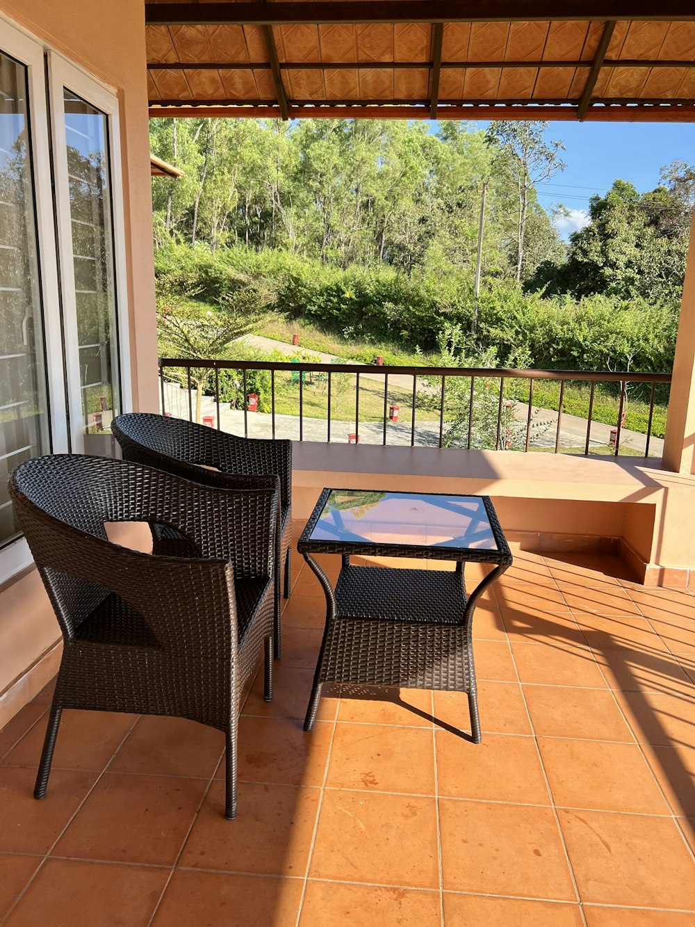 a patio with a table and chairs on it