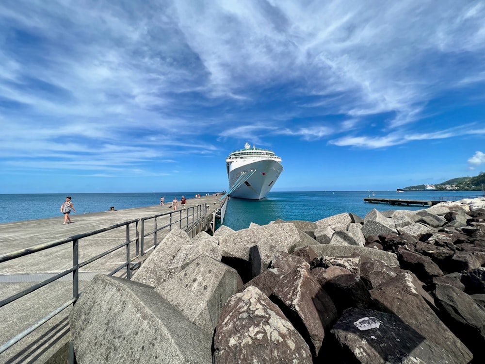 a cruise ship is docked at a pier