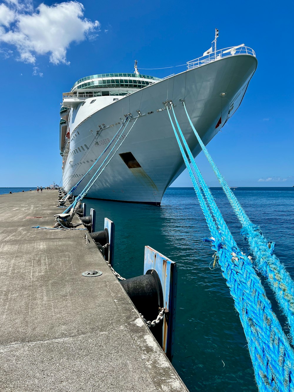 a large cruise ship docked at a pier