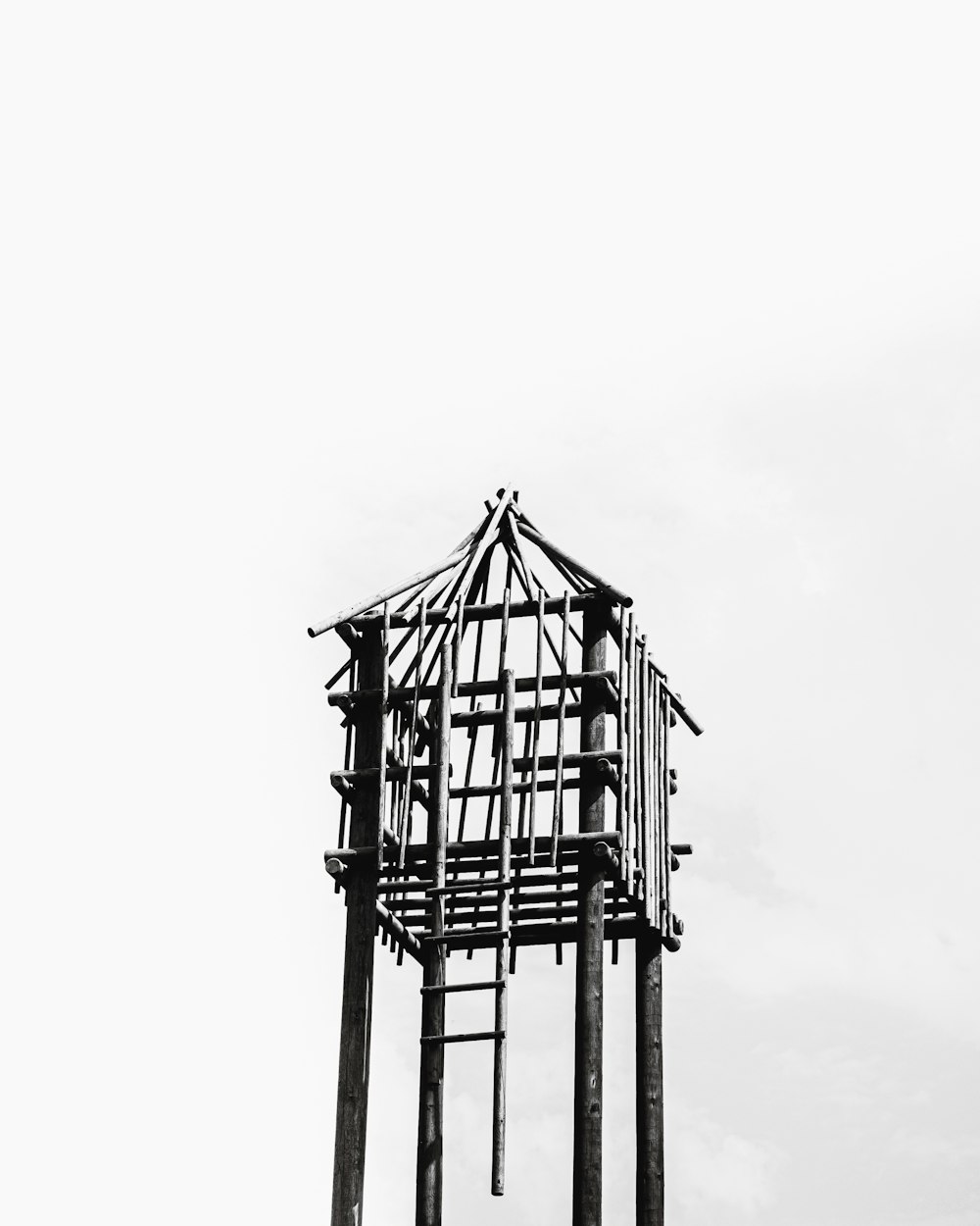 a black and white photo of a clock tower