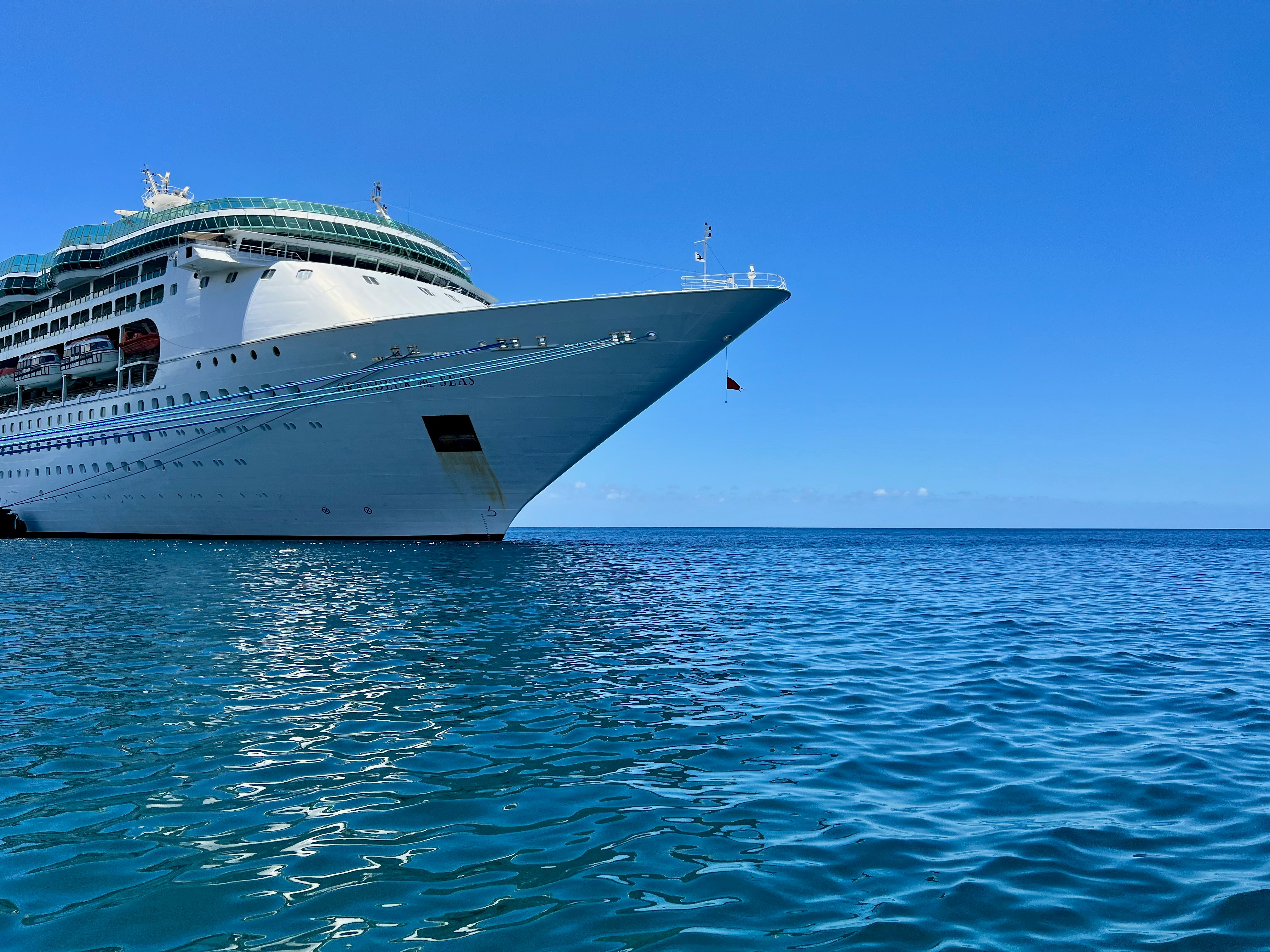 a large cruise ship in the middle of the ocean, 