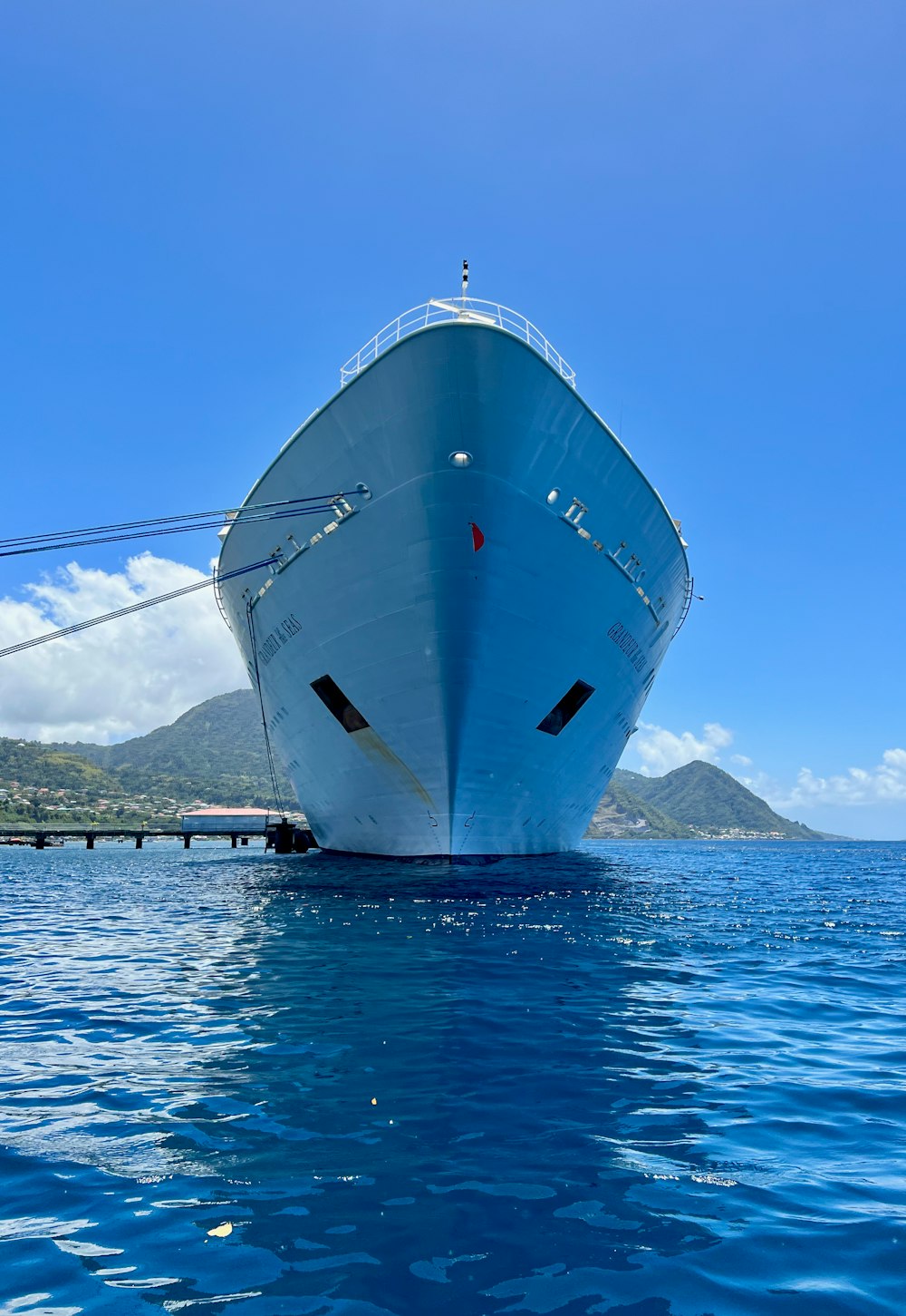 a large white boat floating on top of a body of water