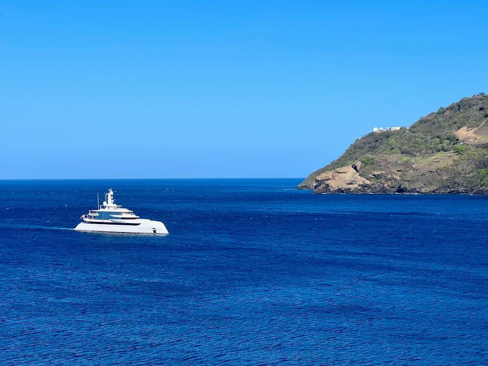 a large white boat in the middle of the ocean