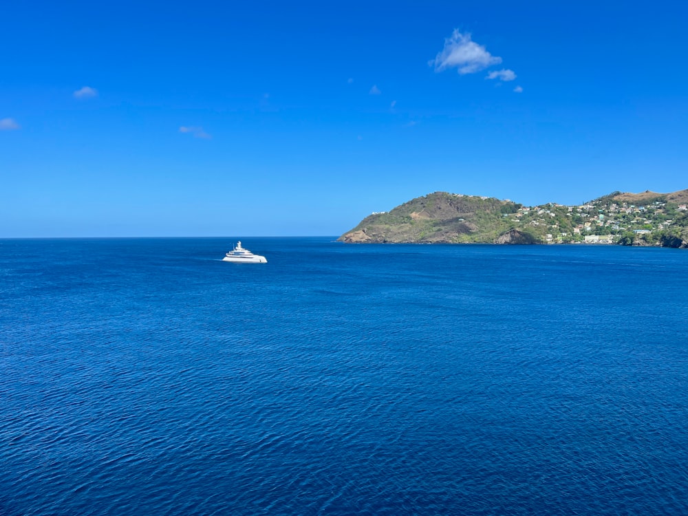 a boat in the middle of a large body of water