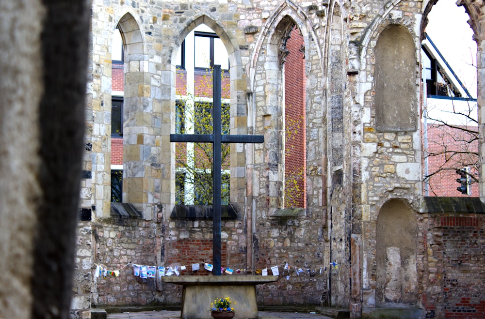 a cross in the middle of a courtyard