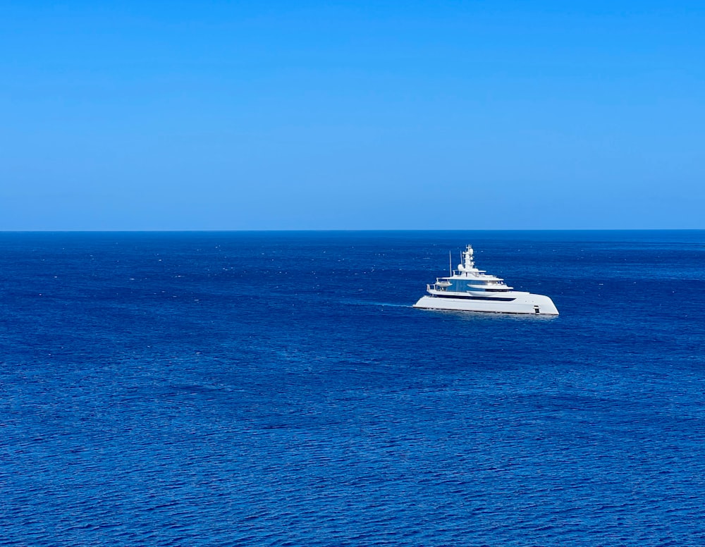 a large white boat in the middle of the ocean