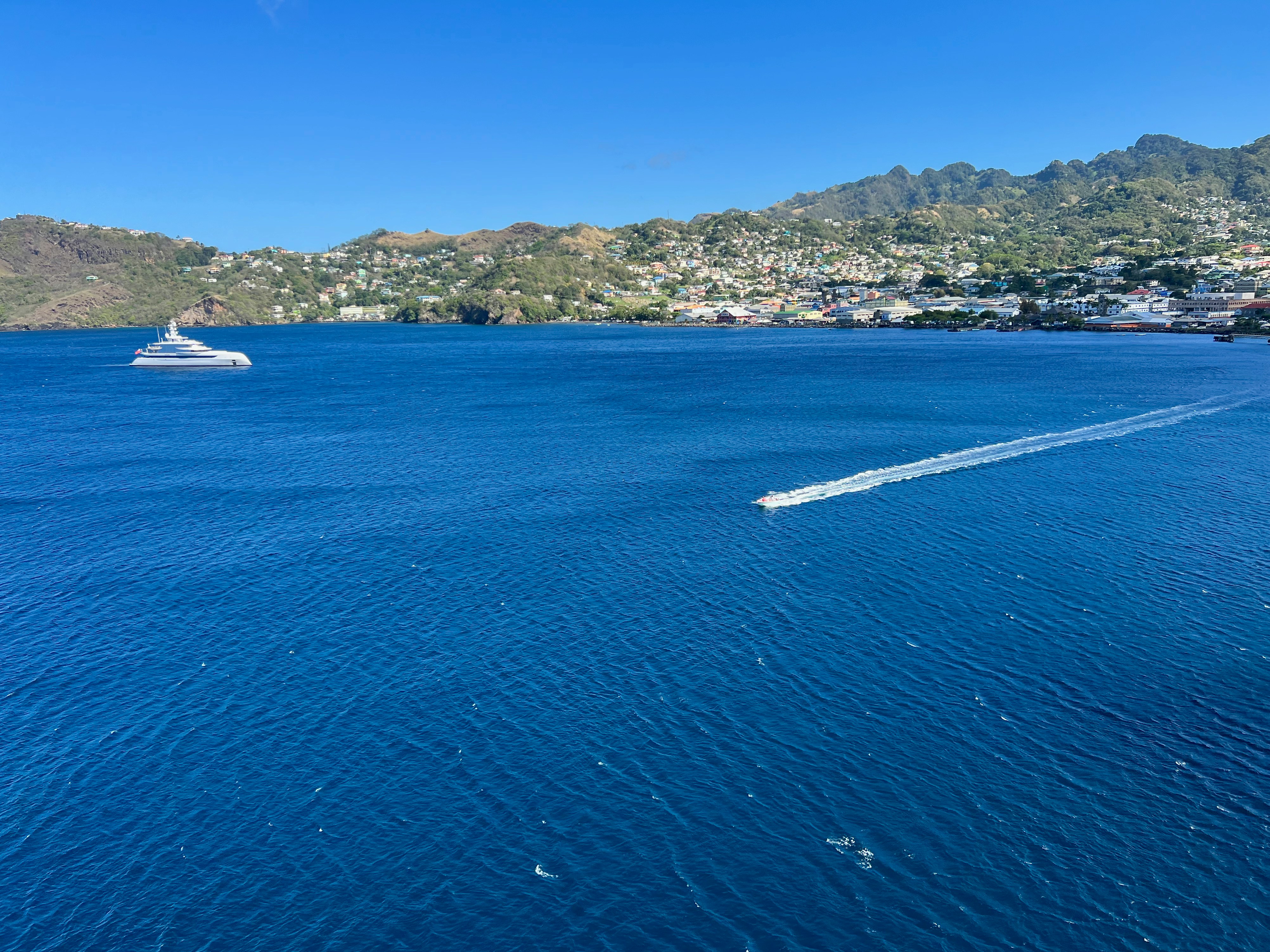 a boat traveling across a large body of water, 