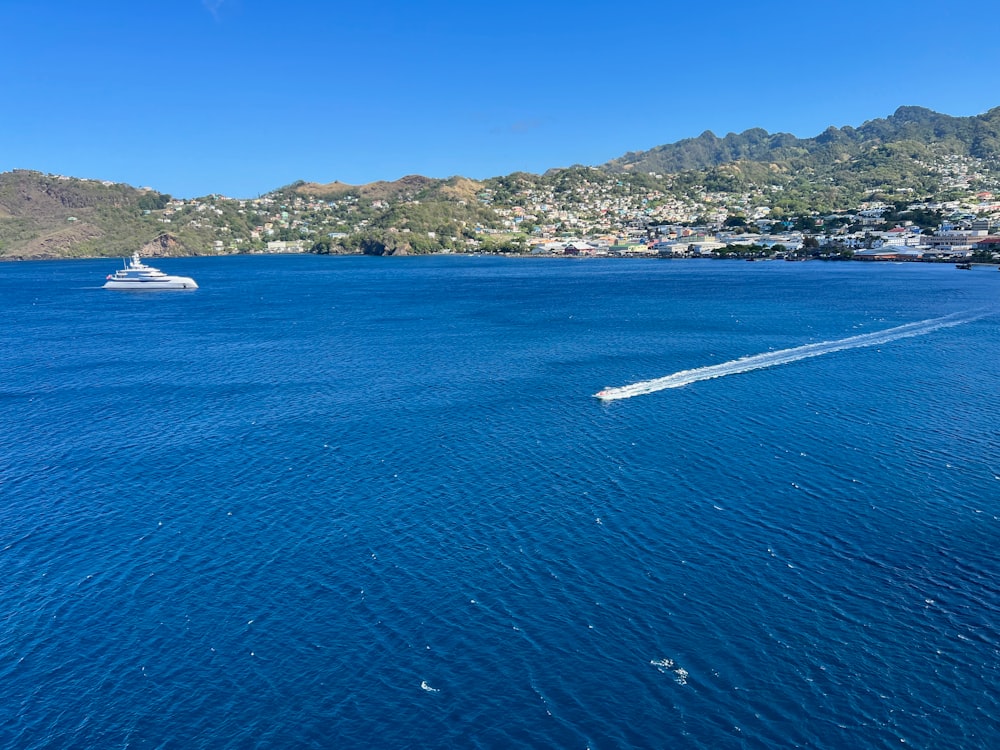 a boat traveling across a large body of water