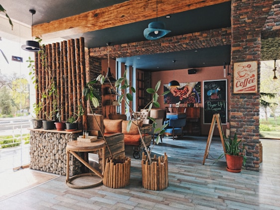 A cozy rustic-themed drink shop corner decorated with white batik patterns and natural wooden elements.