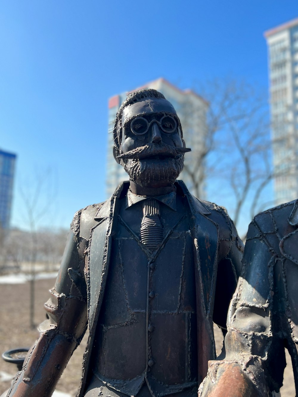 a statue of a man wearing a suit and tie