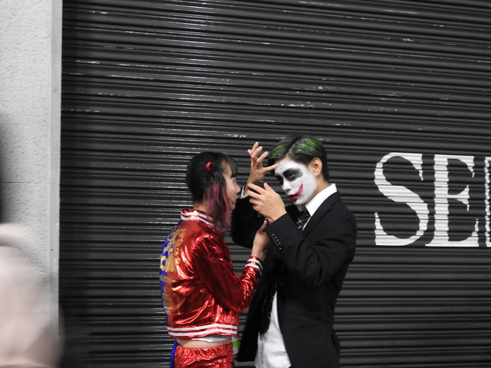 a man and a woman dressed up as the joker