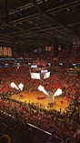 a basketball court filled with lots of people