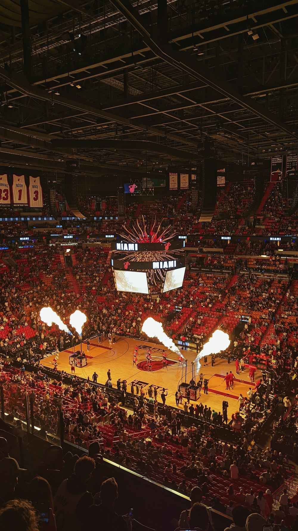 a basketball court filled with lots of people