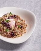 A close-up of a healthy quinoa salad with nuts.