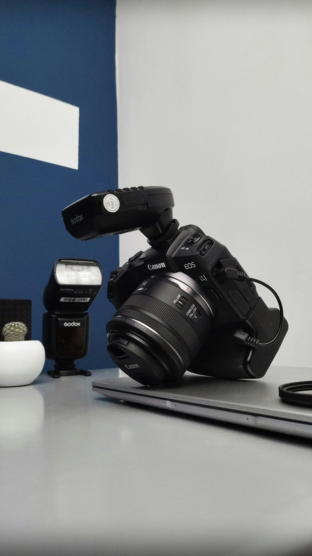 a camera sitting on top of a laptop computer