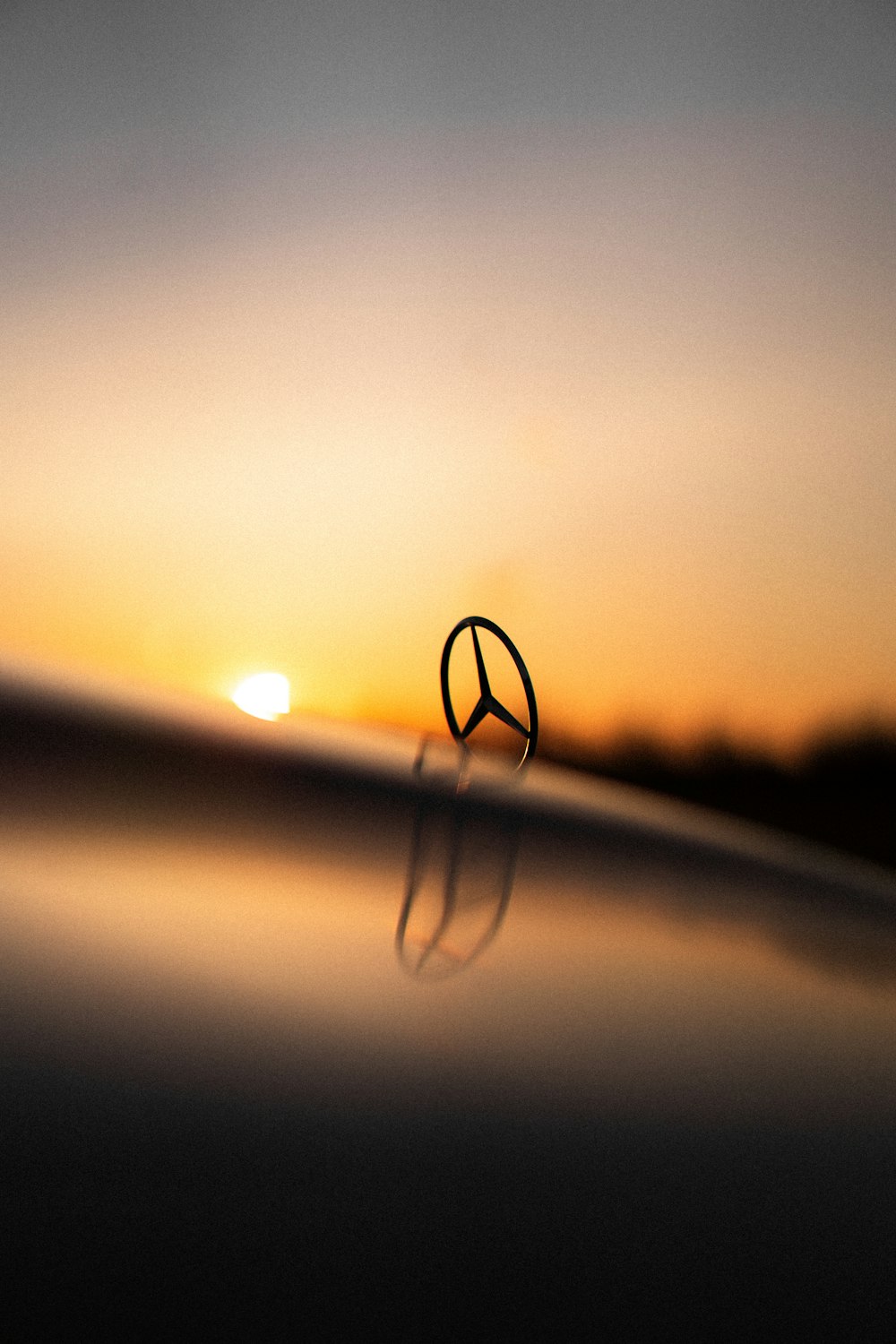 a peace sign sitting on top of a body of water