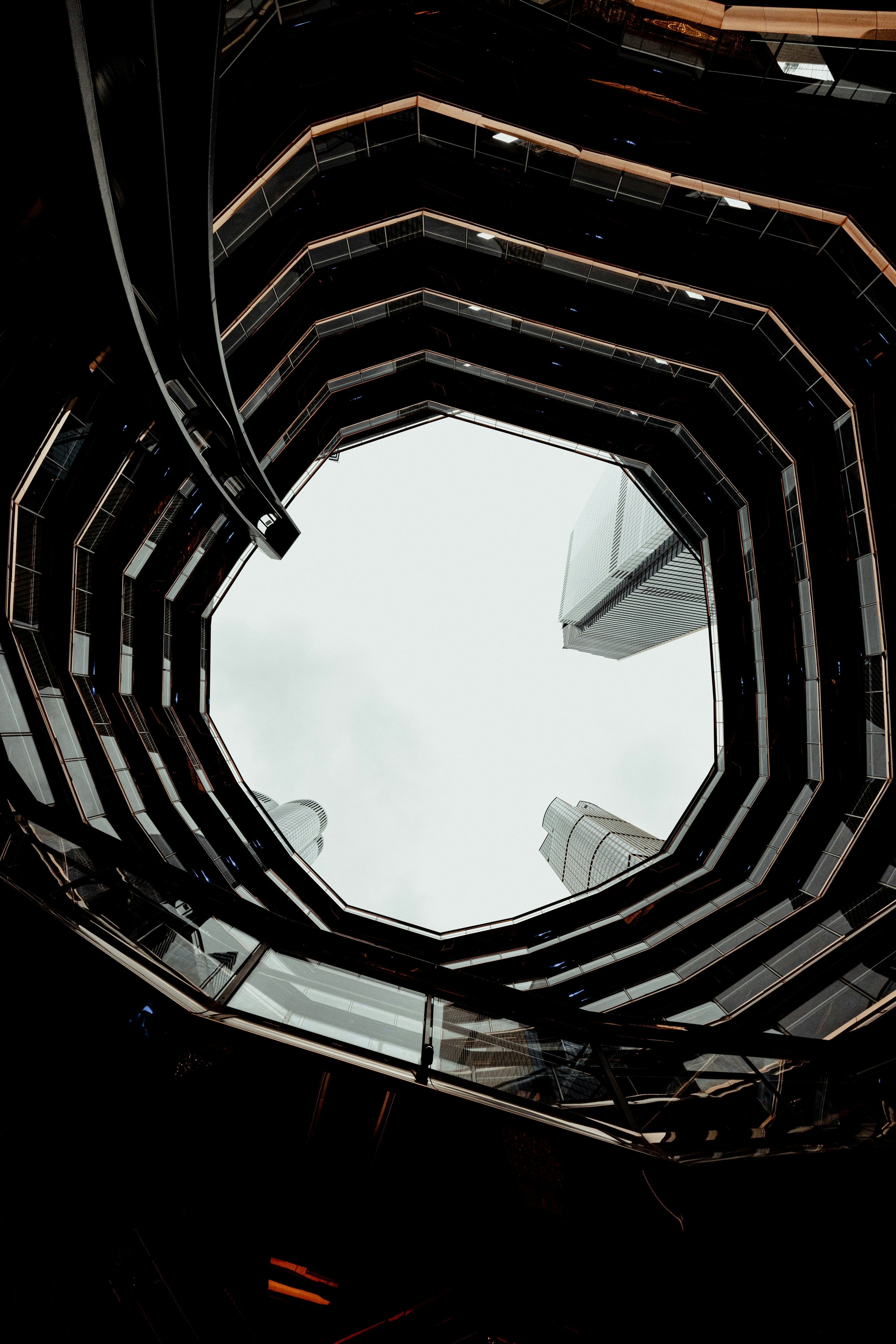 a view of a very tall building through a circular window
