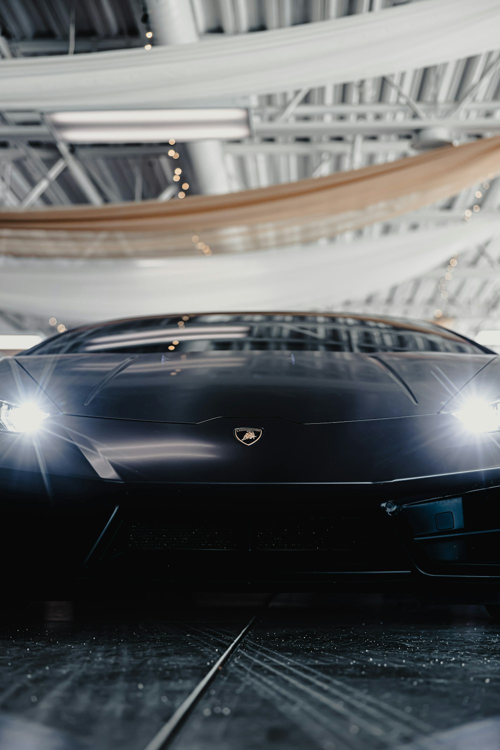 a black sports car parked in a garage