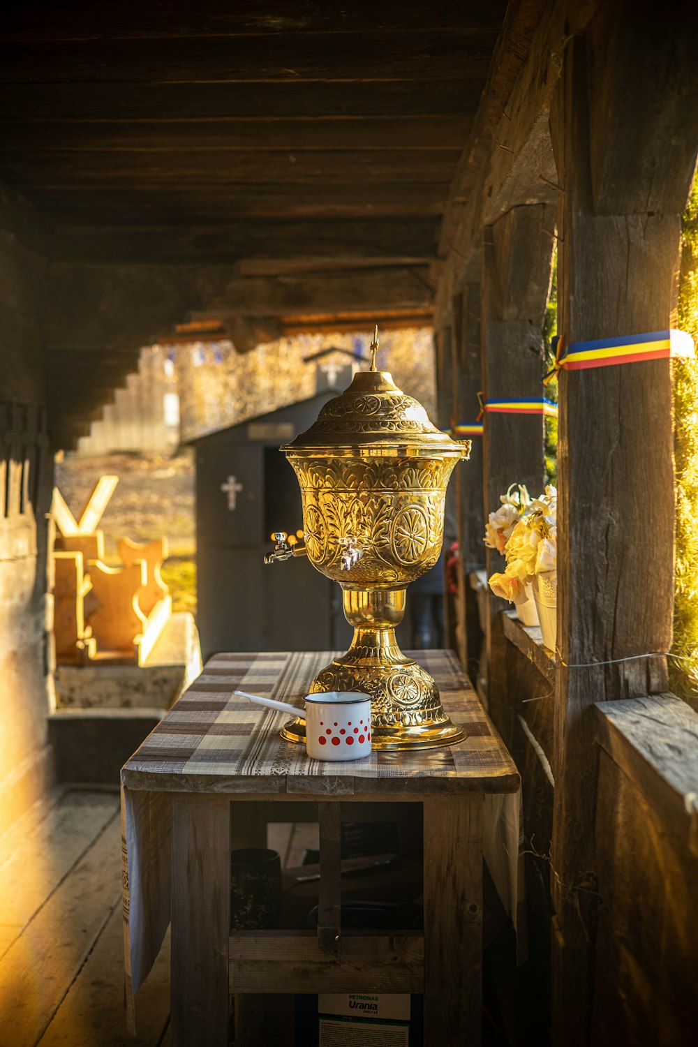 a golden trophy sitting on top of a wooden table