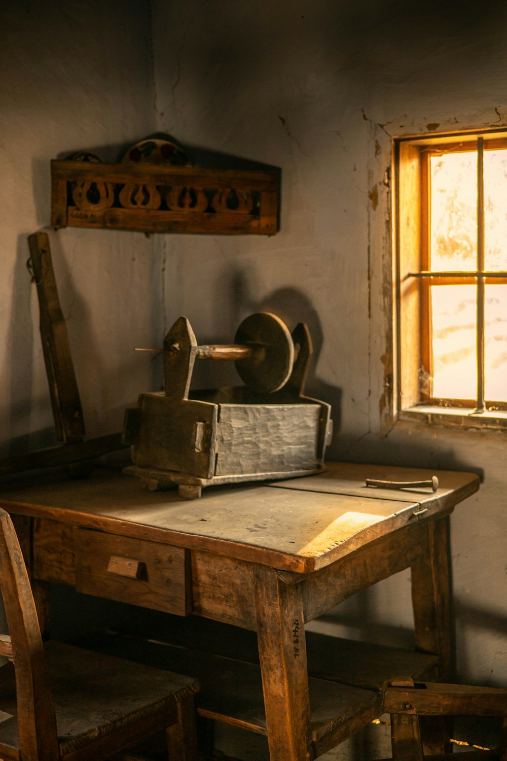 a wooden table with a machine on top of it