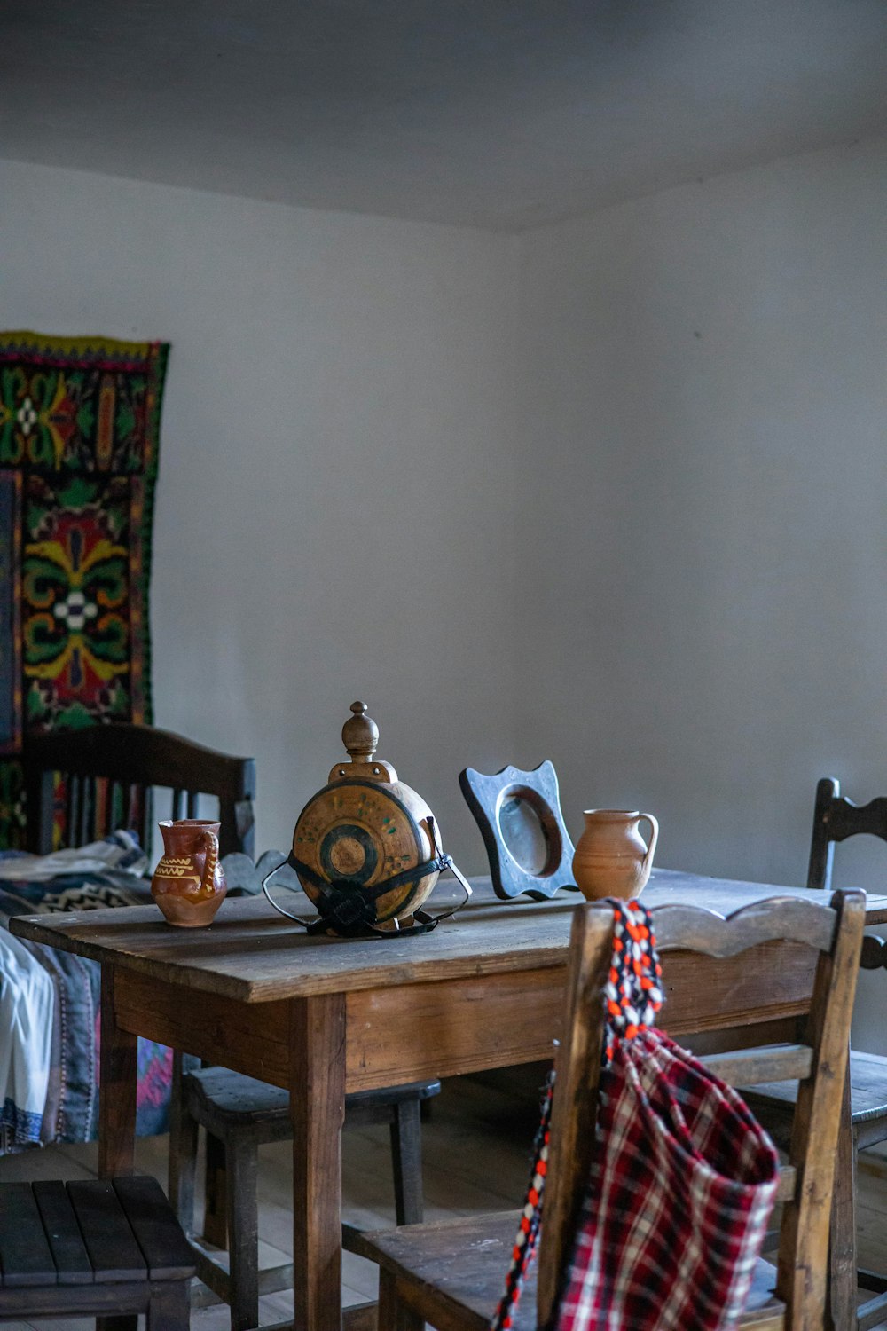 a room with a wooden table and chairs