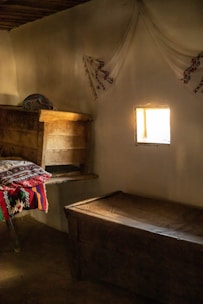 Cozy boutique hotel room with rustic decor and natural light in Tepoztlán.