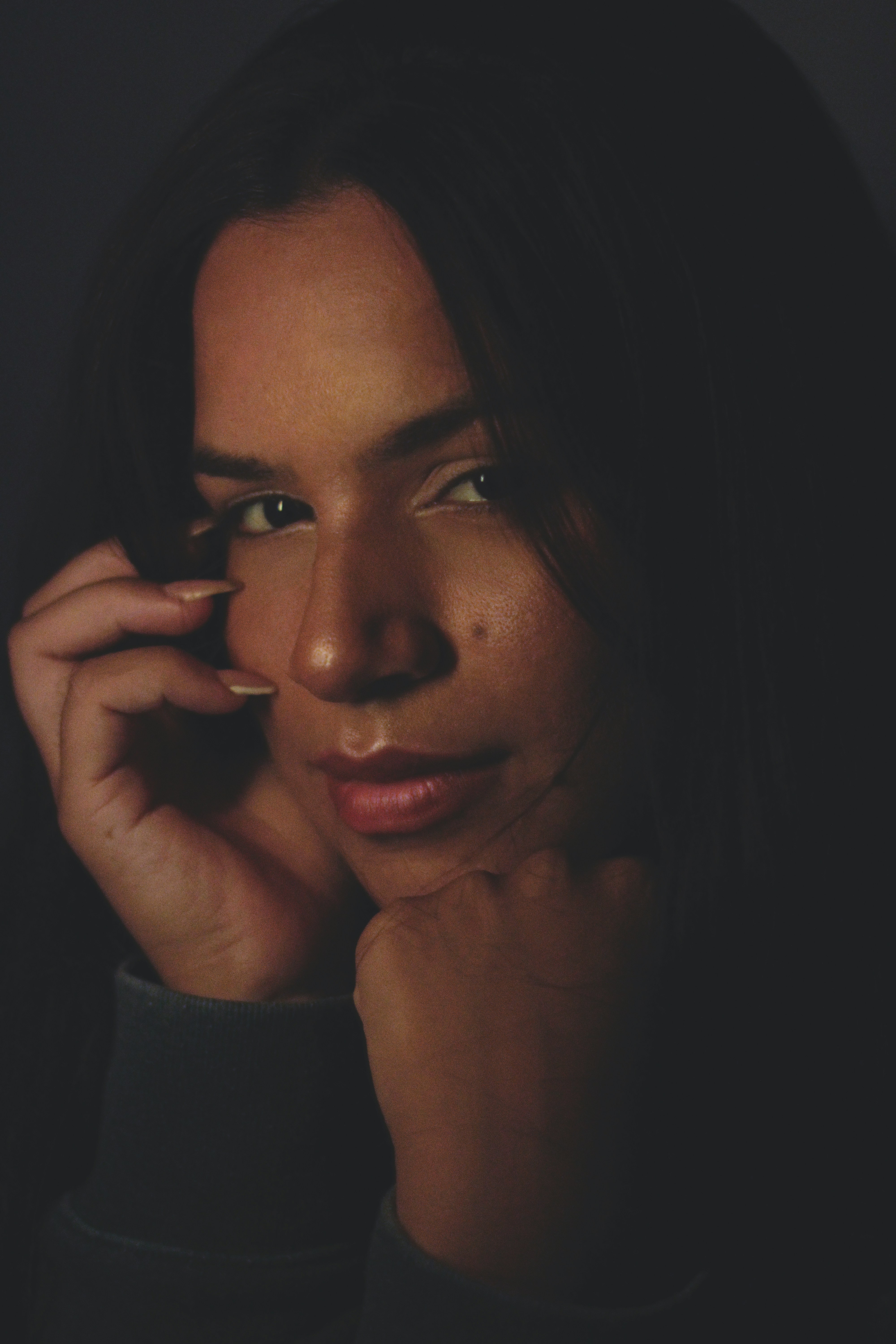 a close up of a person talking on a cell phone