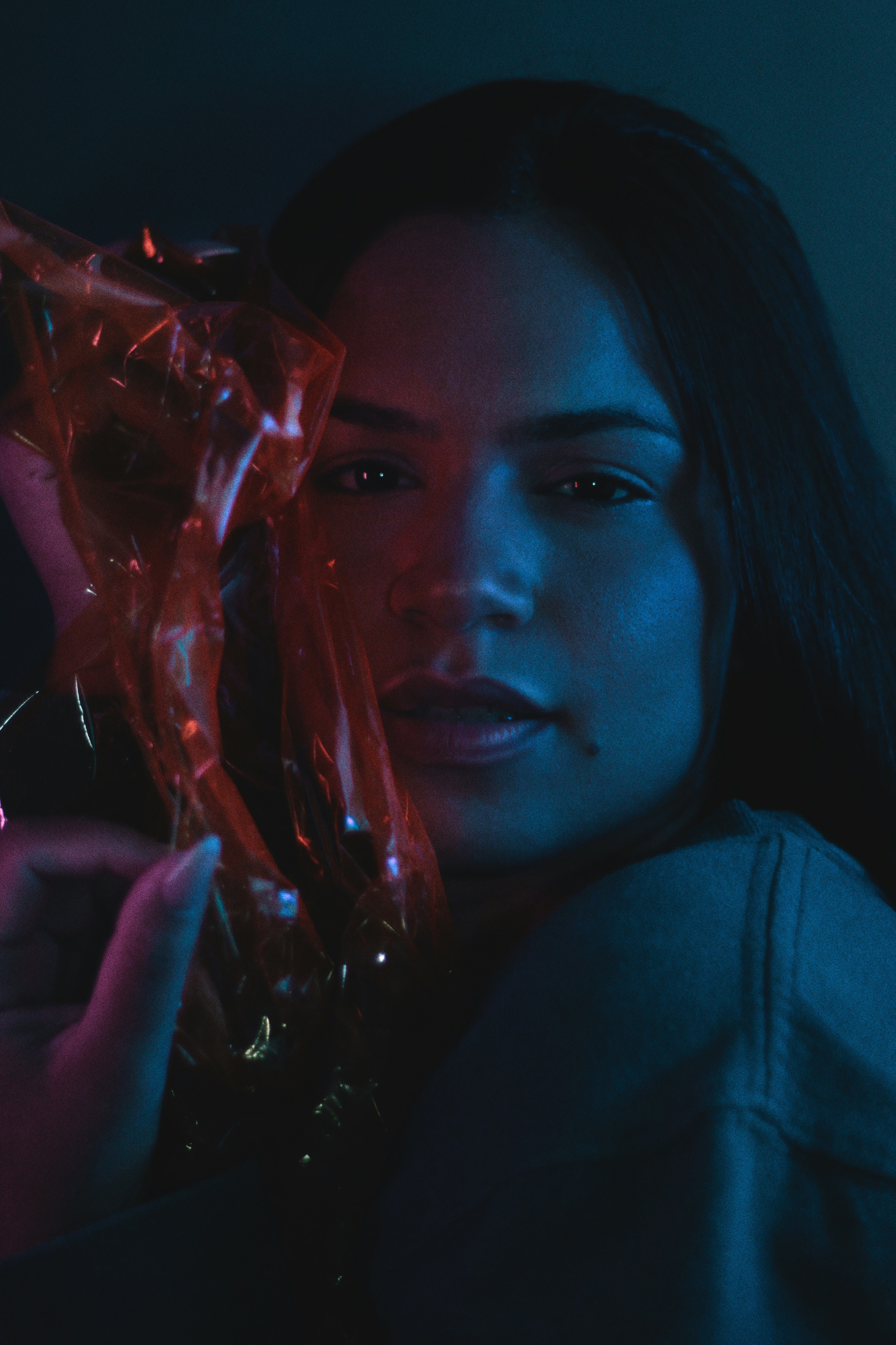 a woman holding a cigarette in her hand