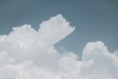 A serene workspace with soft clouds painted on the wall, symbolizing imagination and clarity.