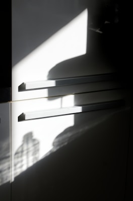 the shadow of a person standing in a room