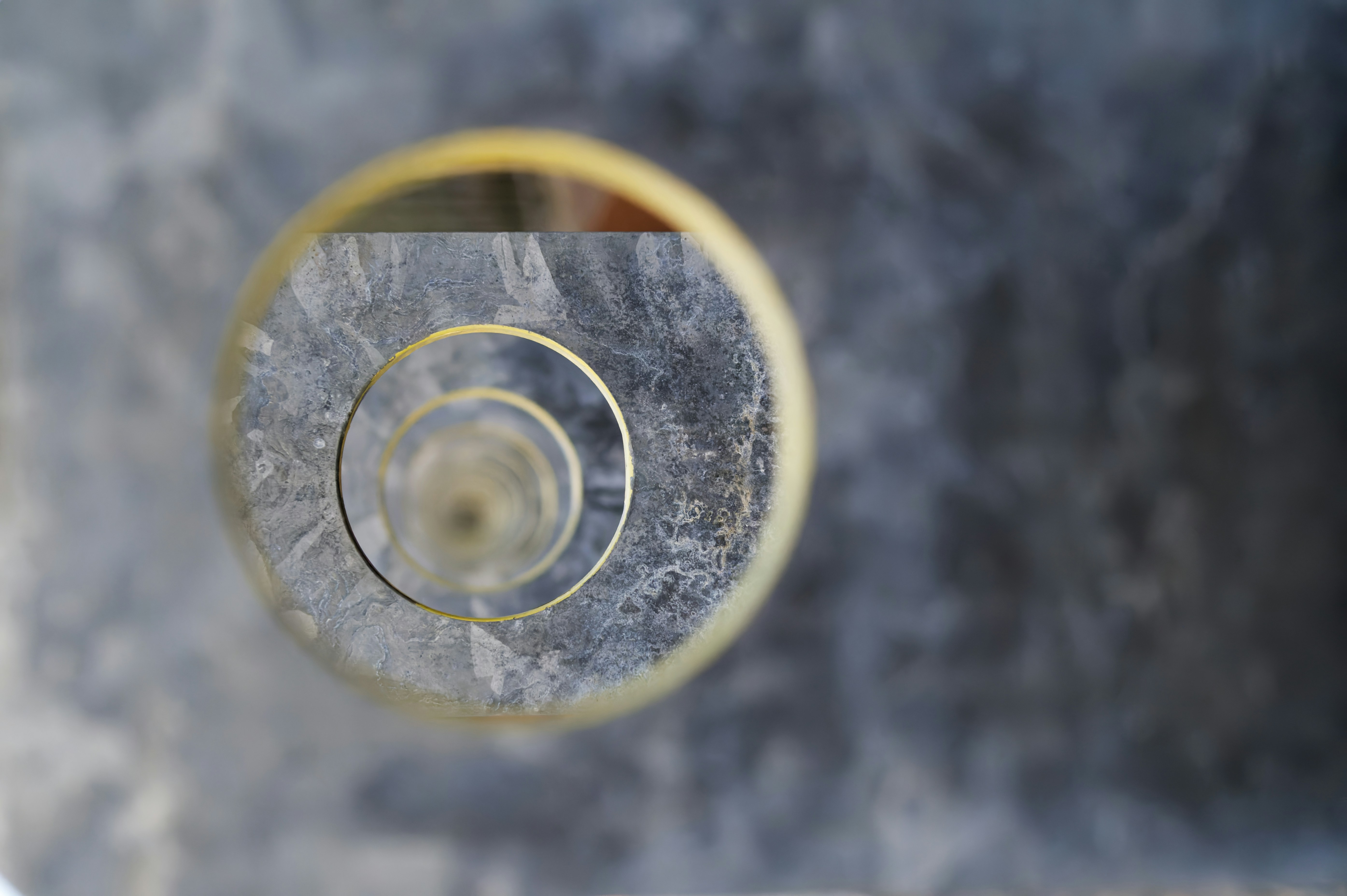 a close up of a wine glass on a table
