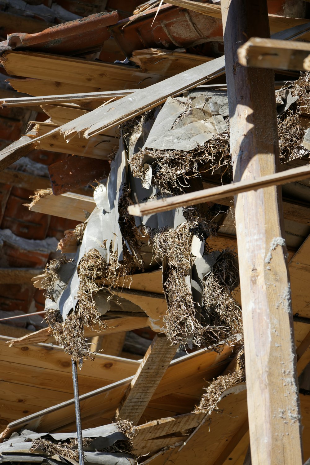 a pile of wood that is next to a building