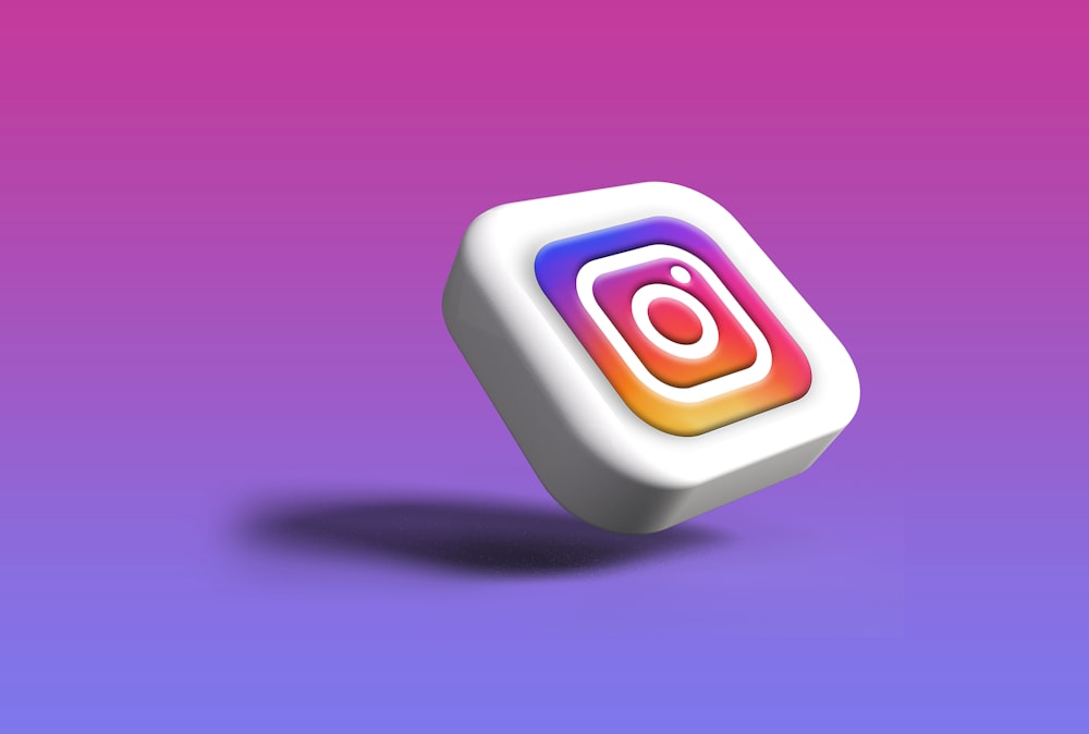 a white cube with a colorful instagram logo on it