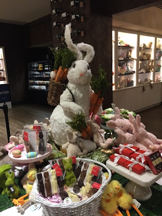 a table filled with lots of stuffed animals and food