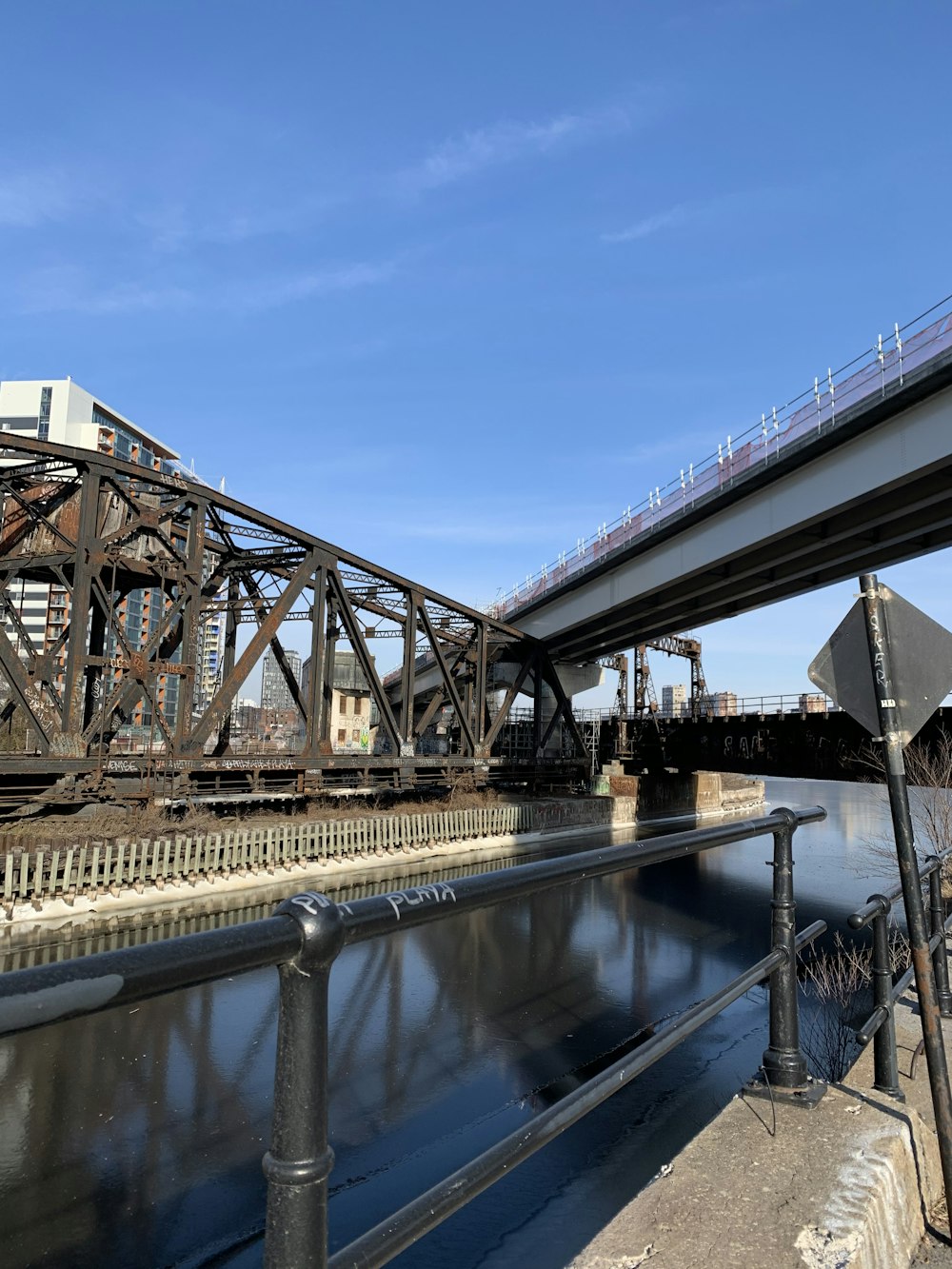 a train traveling over a bridge over a river