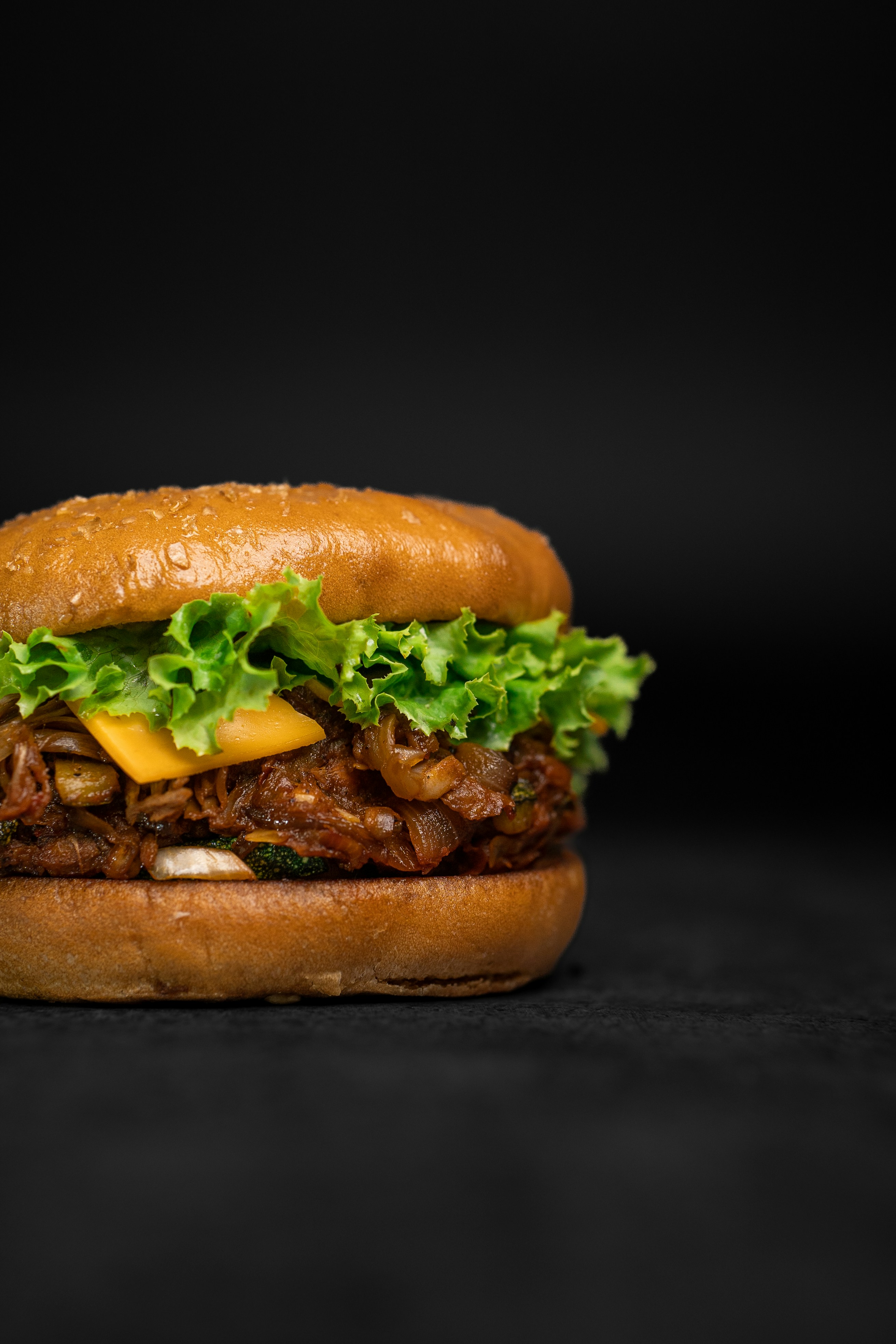 a sandwich with meat, cheese and lettuce