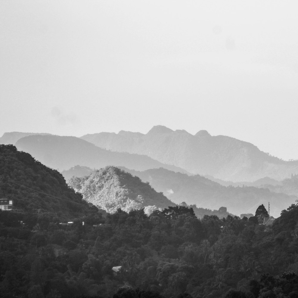 a black and white photo of a mountain range