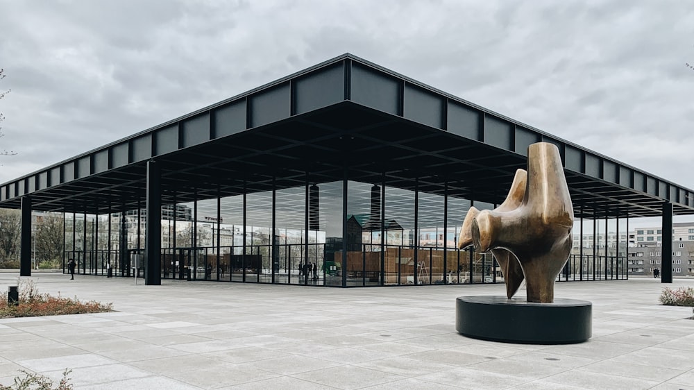 a statue of a dog in front of a building