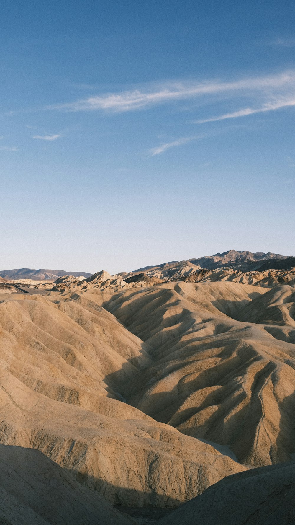 a person riding a horse in the middle of a desert