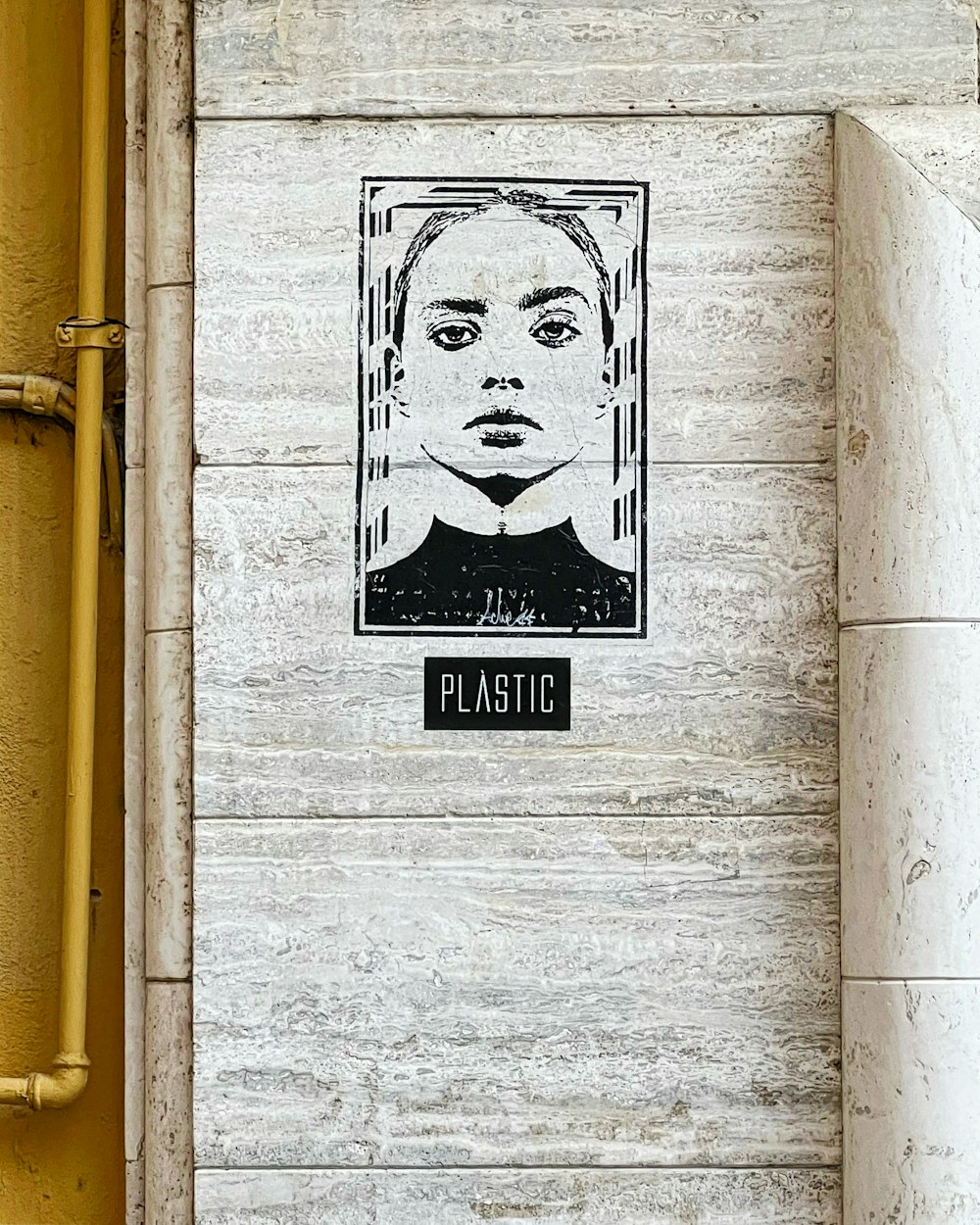 a picture of a woman's face on a wall