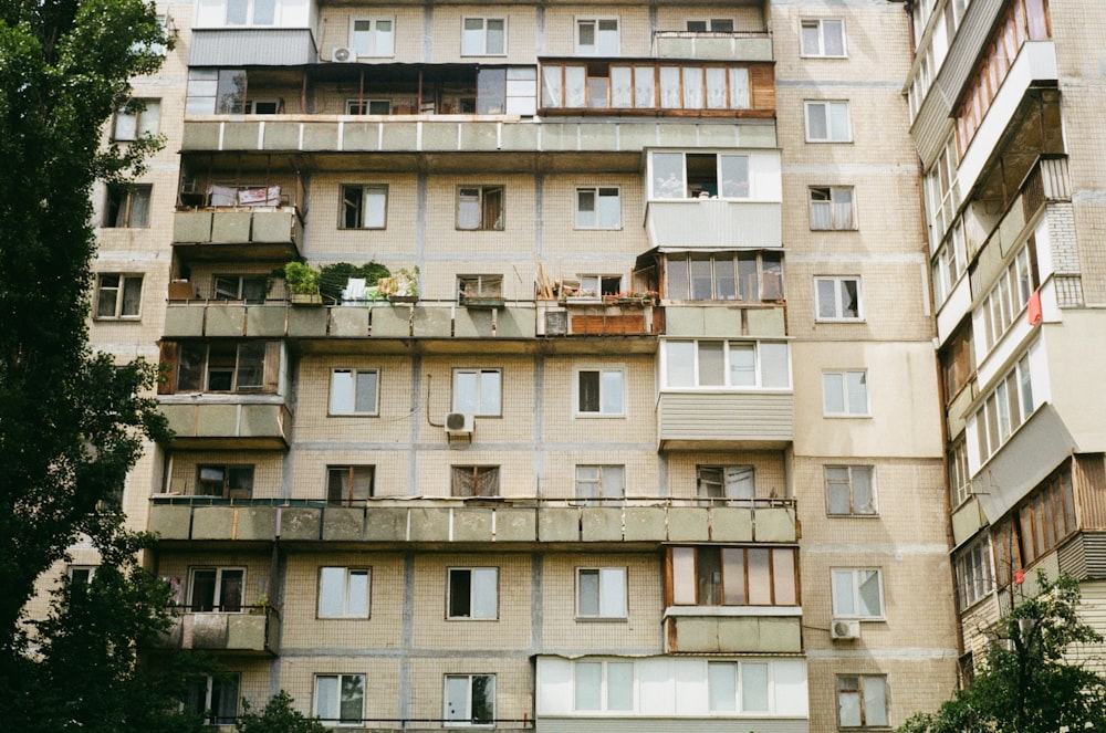 a very tall building with lots of windows and balconies