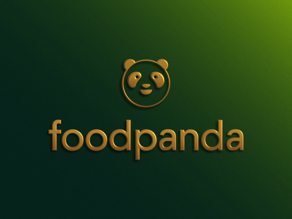 a panda bear logo on a green background