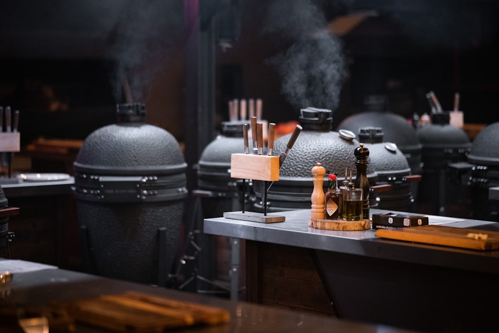 a bunch of smoke coming out of the top of a grill