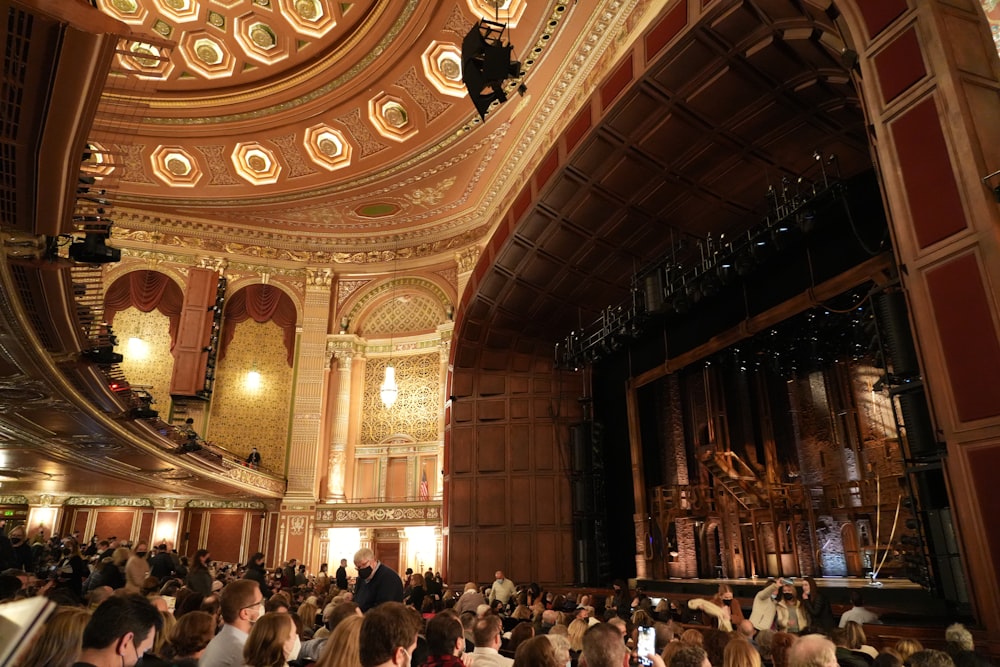 a large crowd of people in a large building